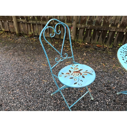 3 - A painted shabby chic blue/green metal circular garden table, folding, and two chairs