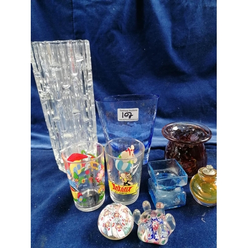 107 - Nine pieces of glassware, including a paper weight