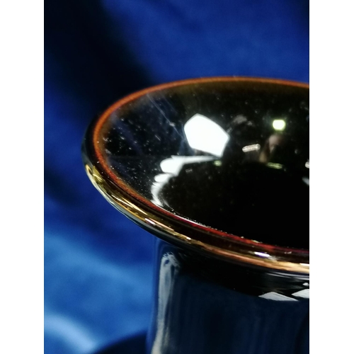 247 - A blue/white Oriental teapot with bamboo handle,the cover with a dog foe; also a Japanese chimney va... 