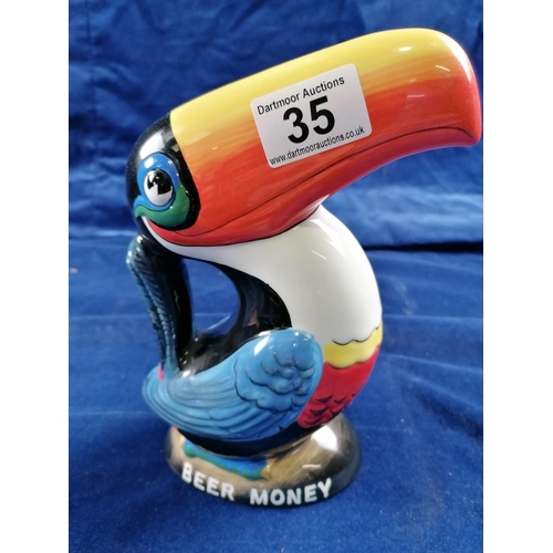 35 - Advertising ware: a pottery money box in the form of the Guinness toucan, 22cm