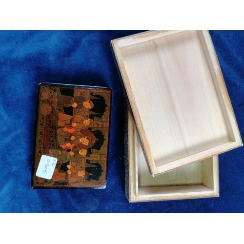 44 - A papier mache Oriental box containing an abacus; also a Persian cigarette box with hunting scene, c... 