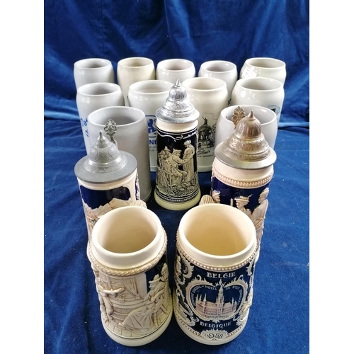 118 - A group of three lidded steins, decorated with huntsmen, revelling figures and a large quantity of l... 