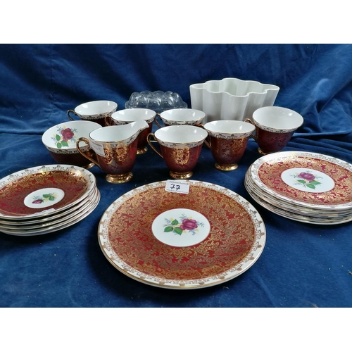77 - A decorative Windsor tea service, the circular outlines, profusely gilded with flowers, conforming d... 