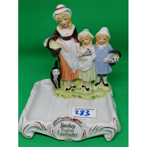283 - A Yardley English Lavender style soap dish moulded with three figures and a dog, 15cm wide