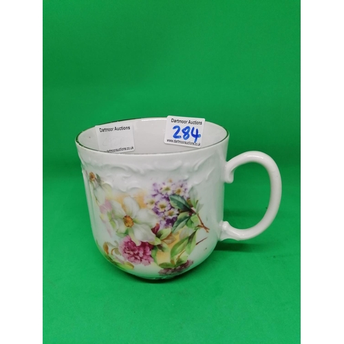 284 - A decorative late 19C German pottery large breakfast cup, brightly transfer printed with flowers, 14... 