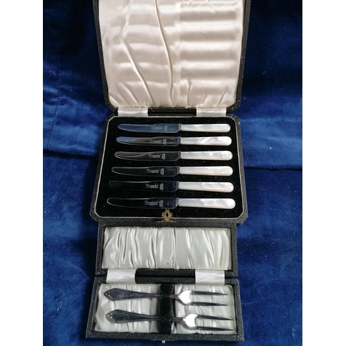 264 - A boxed pair of EP pickle forks also a boxed set of 6 tea knives with MOP handles
