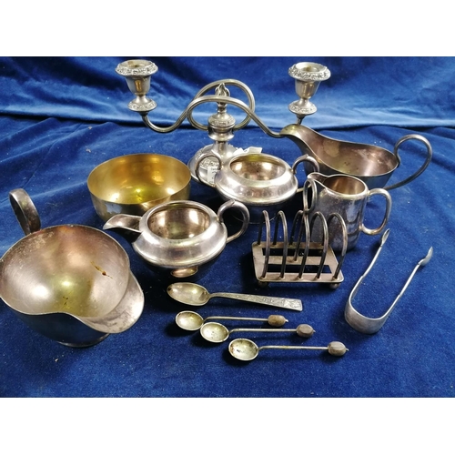 267 - A plated two light candelabrum with embossed edges, 26cm and other plated items