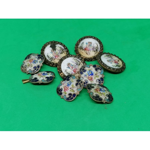 269 - A set of five attractive French buttons, probably silver, enamelled with flowers, also a further set... 