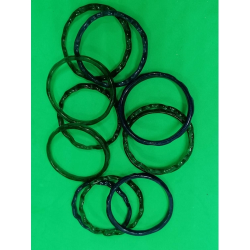 271 - Eleven green and blue glass curtain rings , 6cm diameter