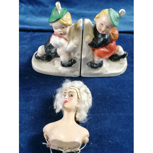286 - A pair of 1930s Hummel style bookends, each in the form of children climbing A/F; also a vintage dol... 