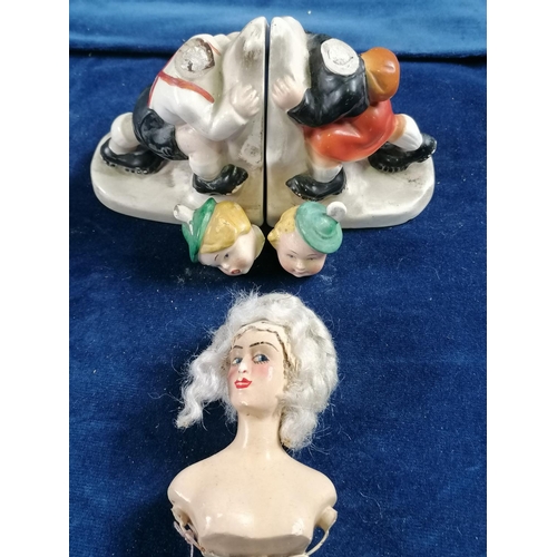 286 - A pair of 1930s Hummel style bookends, each in the form of children climbing A/F; also a vintage dol... 