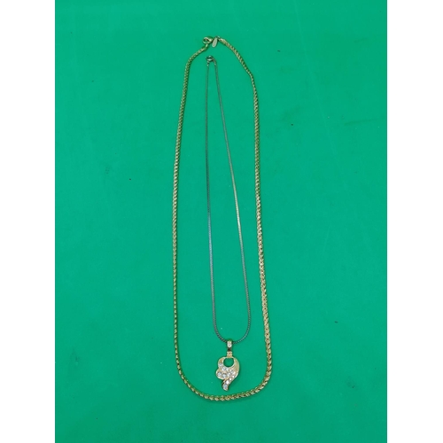 273 - A long fancy flat-link neck chain, 60cm long; also a fine neck chain with fancy pendant
