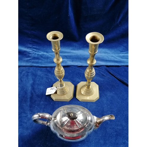 243 - A silver plated teapot JD & S; also a pair of brass  candlesticks ht 31cm