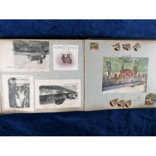 275 - Another photograph album from early 20C, leather bound containing photographs, cuttings, postcards e... 