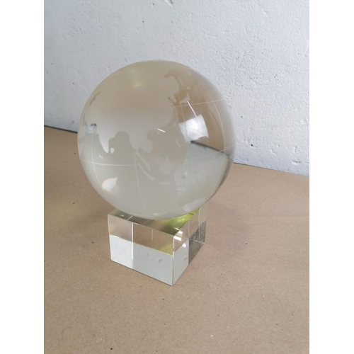 289 - A large glass paperweight on a similar stand