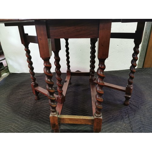 103 - 1920's Oak Dropleaf Coffee Table with Carved Top and Barley Twist Legs.

29x47x35 Inches.