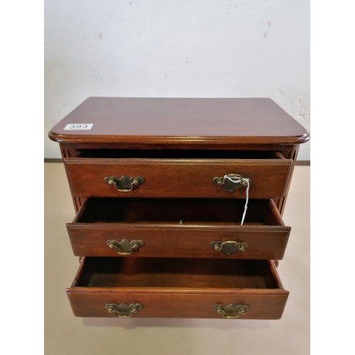 393 - A miniature oak 3 drawer chest with brass handles