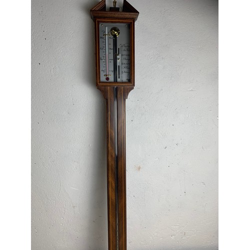 422 - An antique stick barometer