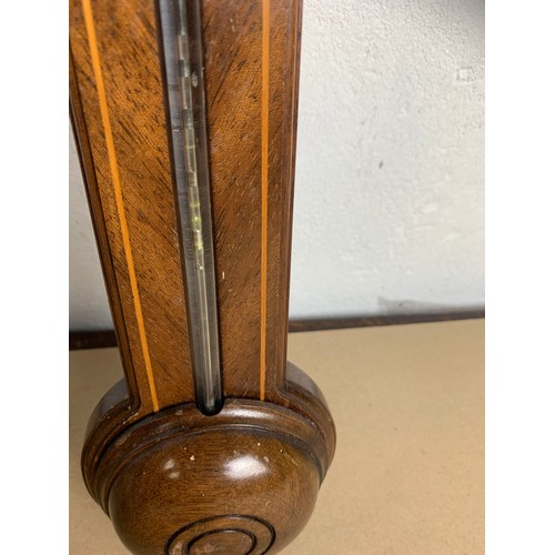 422 - An antique stick barometer