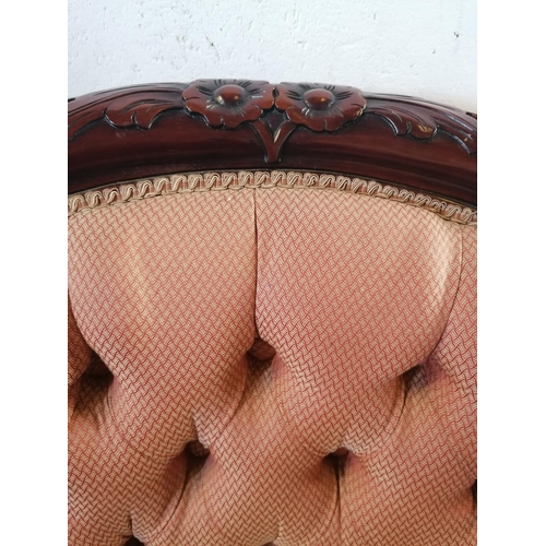 134 - Reproduction mahogany button back upholstered arm chair.