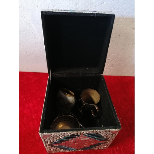 208 - Small decorative hinged storage box with odd items of metalware.