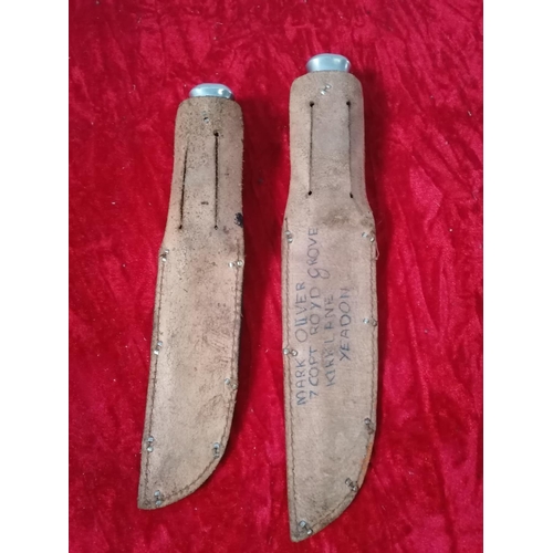 223 - 2 vintage hunting sheath knives one with leather binding, the other with antler handle.