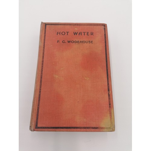 1021 - Hardback, 'Hot Water' by P.G. Wodehouse. Bound in red cloth with black lettering on f/board and spin... 