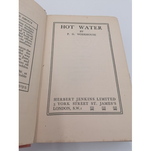 1021 - Hardback, 'Hot Water' by P.G. Wodehouse. Bound in red cloth with black lettering on f/board and spin... 