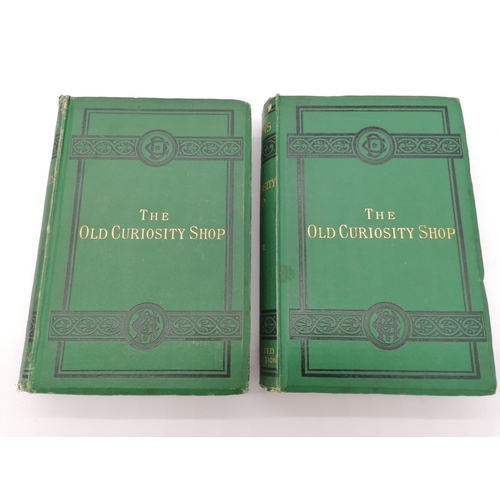 1049 - 2 Hardbacks, 'The Old Curiosity Shop' by Charles Dickens. Bound in green cloth with 2 black deco bou... 