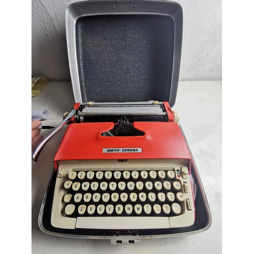 151 - Smiths Corona red typewriter in case. (collectable)