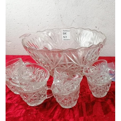 57 - Large glass decorative punch bowl and 8 matching glass cups.