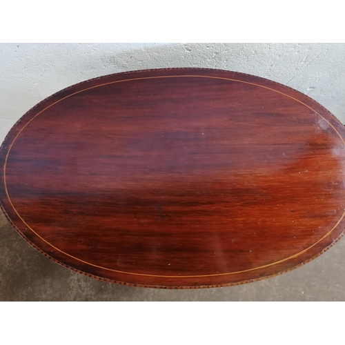 290 - Oval inlaid mahogany nest of three tables