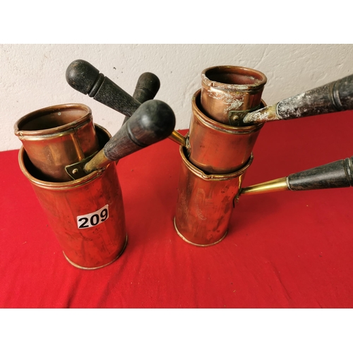 209 - A wonderful collection of Copper Measuring Jugs