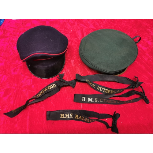 231 - 2 army caps + naval cap straps.