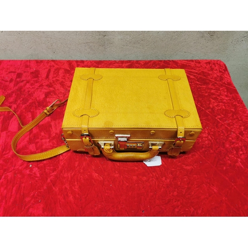 215 - Leather travel case. 4.5x12.25x8.5 inches. Good condition - some minor stains on top.