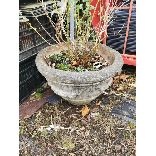 413 - Non matching pair of aged concrete planters.