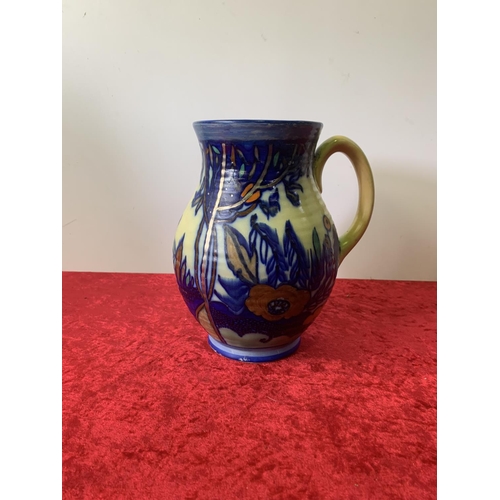 544 - Hand painted jug - small damage to rim - as found. 23 cm high