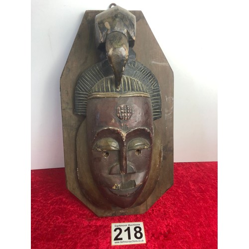 218 - Native mask on wood hanging base, base measures approx. 50cm x 27am