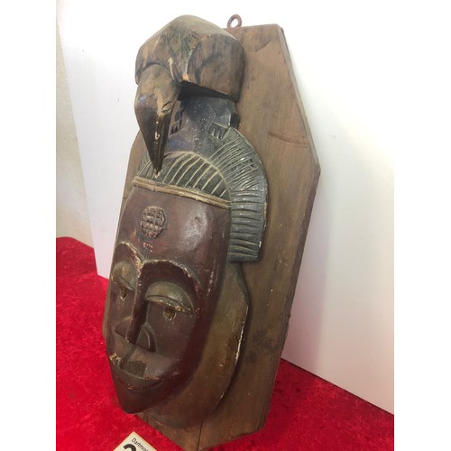 218 - Native mask on wood hanging base, base measures approx. 50cm x 27am