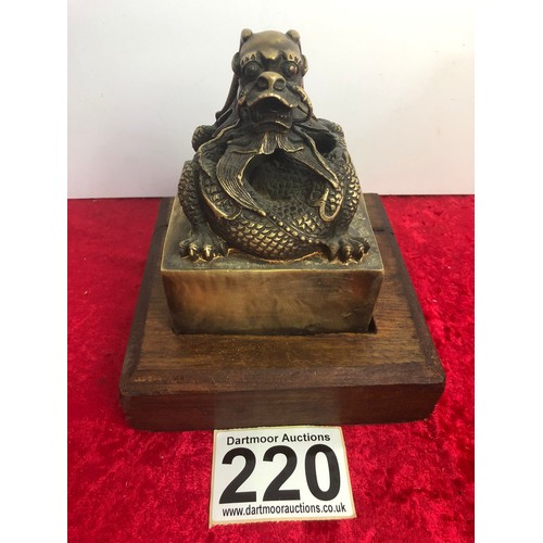 220 - Large brass Chinese dragon seal on an oak base