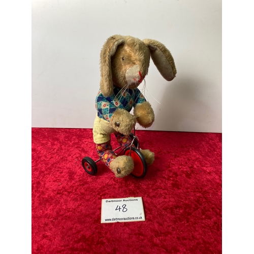 48 - Quaint children's Toy Rabbit on Scooter (height approx. 28cm)