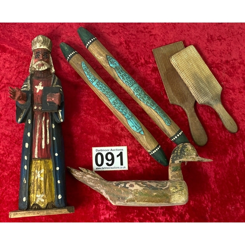 91 - A collection of wooden items including A Bishop, Butterpats, a decoy duck and a snake stick