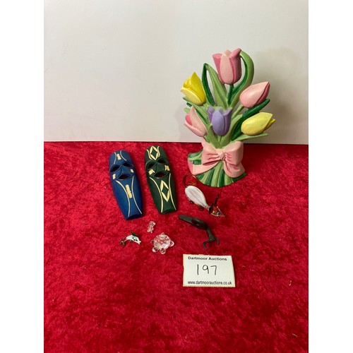 197 - Collectibles including Cast Iron tulip doorstop, ethnic wooden masks, glass animals and an iron snai... 