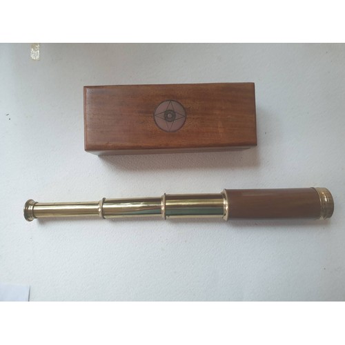 566 - A brass and wooden telescope. contained in a brass bound hardwood box.  40 cm