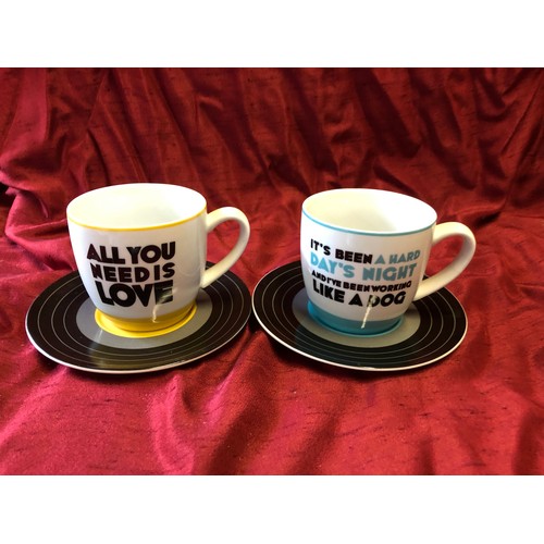 240 - The Beatles 'Hard Days Night' and 'All You Need is Love' cups and saucers with record design in exce... 