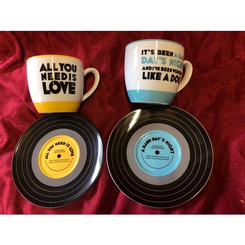 240 - The Beatles 'Hard Days Night' and 'All You Need is Love' cups and saucers with record design in exce... 