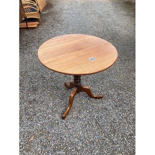 469 - Round topped wooden table - 63cm tall