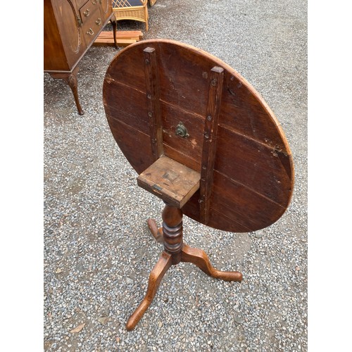 469 - Round topped wooden table - 63cm tall