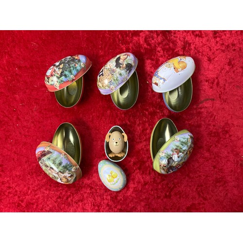 129 - 6 new Easter Egg tins, one with wooden toy inside