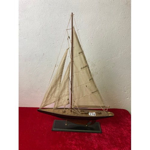 178 - Wooden sailing boat model /pond yacht on stand. Hull is approx 23